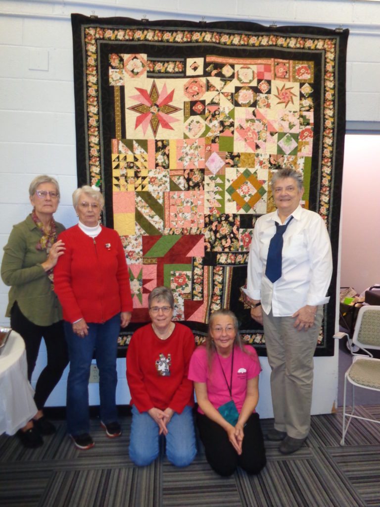 Throw communique quilt made by a local quilt guild. Shared via email.